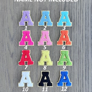May include: Twelve felt letter patches in various colors, each with a gold outline. The letters are arranged in three rows of four, with numbers 1 through 12 below each letter.