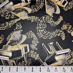 May include: Black fabric with a gold musical pattern. The pattern features grand pianos and musical notes.