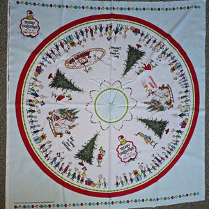 May include: A white and red circular Christmas tablecloth with a green Grinch character and the text "Merry Christmas" and "How the Grinch Stole Christmas!" printed on it. The tablecloth features a repeating pattern of green Christmas trees, red presents, and small figures.