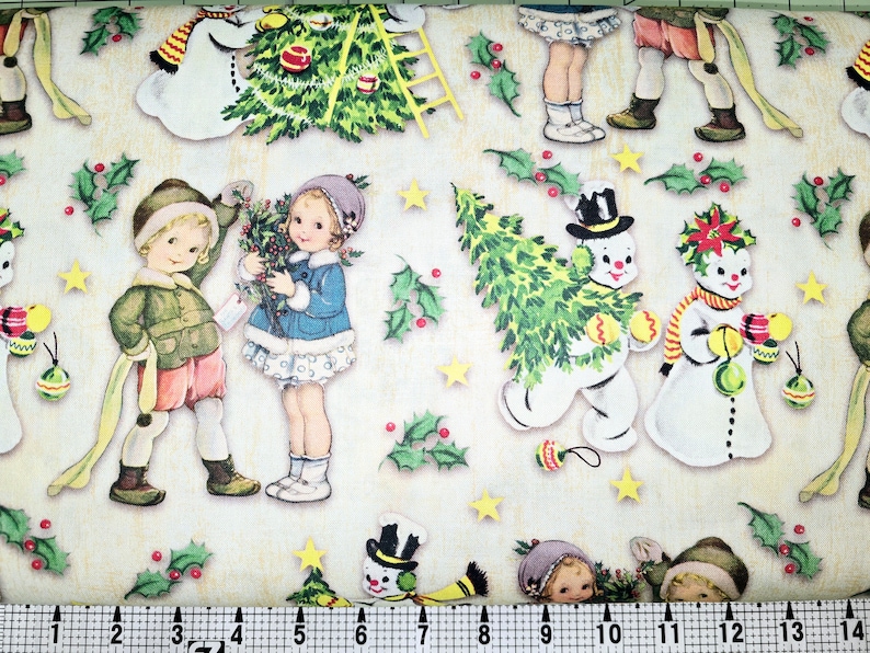 May include: A vintage Christmas wrapping paper design featuring children and snowmen. The paper is cream colored with green holly leaves, red berries, and yellow stars. The children are dressed in winter clothing and are holding Christmas trees and ornaments. The snowmen are wearing hats and scarves and are holding ornaments.