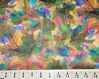 May include: A colorful fabric with a repeating pattern of overlapping leaves in shades of green, brown, blue, pink, and yellow.