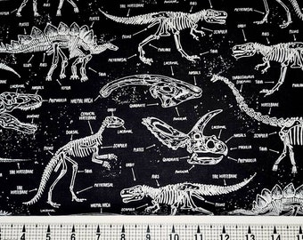 May include: Black and white fabric with a repeating pattern of dinosaur skeletons. The skeletons are labeled with anatomical terms like "dorsal", "scapula", and "vertebrae".