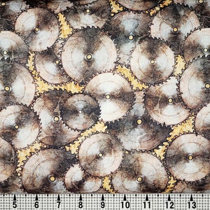 May include: A fabric with a repeating pattern of brown and gold saw blades. The saw blades are arranged in a random pattern and overlap each other.