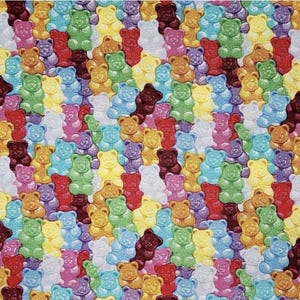 May include: A colorful pattern of gummy bears in various colors, including red, orange, yellow, green, blue, purple, and white. The gummy bears are arranged in a diagonal pattern.