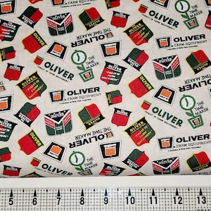 Sykel Enterprises Oliver Logos on Cream 10430 Fabric by the Yard//Piece