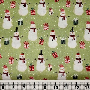 Bonhommes de neige sur tissu vert clair par mètre//pièce