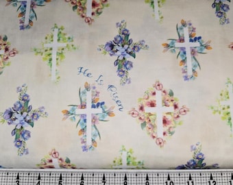 Puede incluir: Tela con cruces blancas adornadas con arreglos florales coloridos en tonos rosa, azul y verde. La frase "He Is Risen" está escrita en escritura azul. El fondo es de color beige claro.