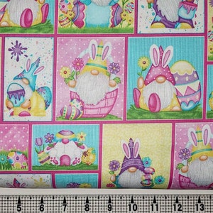 May include: A colorful fabric with a repeating pattern of gnomes wearing bunny ears and holding Easter eggs. The gnomes are surrounded by flowers and other Easter decorations.