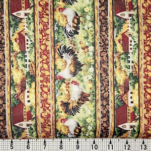 May include: A green and brown fabric with a repeating pattern of red barns, white fences, green leaves, and roosters. The fabric has a yellow and gold stripe running down the centre.