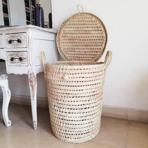 Tall woven laundry basket with handles and lid
