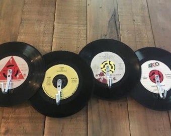 Upcycled 45 Record Rack featuring four 7" vinyl records with heavy duty hooks.  Perfect for a music fan's keys, belts, jewelry and more!