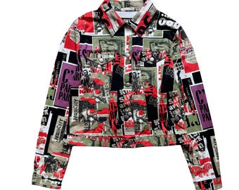 May include: A long-sleeve jacket featuring a multi-colored graphic print with red, black, white, and olive green blocks. The jacket includes a pointed collar, a front button closure, two chest pockets with button flaps, and text elements.