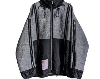 Giacca con cappuccio Alexander McQueen / Cappotto tecnico grigio e nero con zip