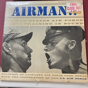 May include: A vintage vinyl record titled "Airman" featuring two men in uniform. The record cover has the text "United States Air Force Basic Training in Sound" and "Final Close Out". The record was recorded at Lackland Air Force Base, Texas.