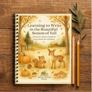 May include: A spiral-bound notebook with the title "Learning to Write in the Beautiful Season of Fall." The cover illustration depicts autumn scenes with pumpkins, a squirrel, a deer, and the text "Charlotte Mason Inspired Copy Work for Children." Two pencils and greenery are placed beside it.