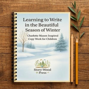 May include: A spiral-bound notebook with the title "Learning to Write in the Beautiful Season of Winter" and the text "Charlotte Mason Inspired Copy Work for Children." The cover features a winter landscape illustration. Two pencils and a sprig of greenery are next to the notebook.