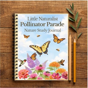 May include: A spiral-bound journal titled "Little Naturalist Pollinator Parade Nature Study Journal" with a colorful illustration of butterflies, bees, flowers, and a hummingbird. Two pencils and a sprig of greenery sit on a wooden surface.