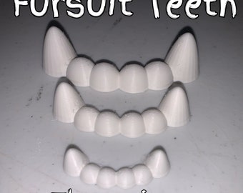 May include: Three sets of white plastic teeth in different sizes. The teeth are designed for use in a fursuit. The text "Fursuit Teeth" is at the top of the image and the text "Three sizes" is at the bottom of the image.