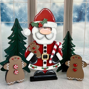 Holly Santa hand painted shelf sitter holding gingerbread man and candy cane, Christmas mantel decor, laser cut wood hand