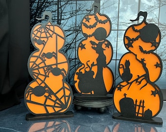 Stacked pumpkin shelf sitter orange with black overlay design, cemetery cat, spiders and webs, witch and brew, laser cut wood