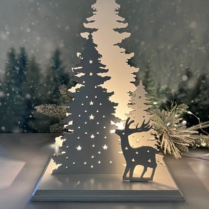 Winter nature scene, snowy trees, reindeer, light up display, Christmas decor