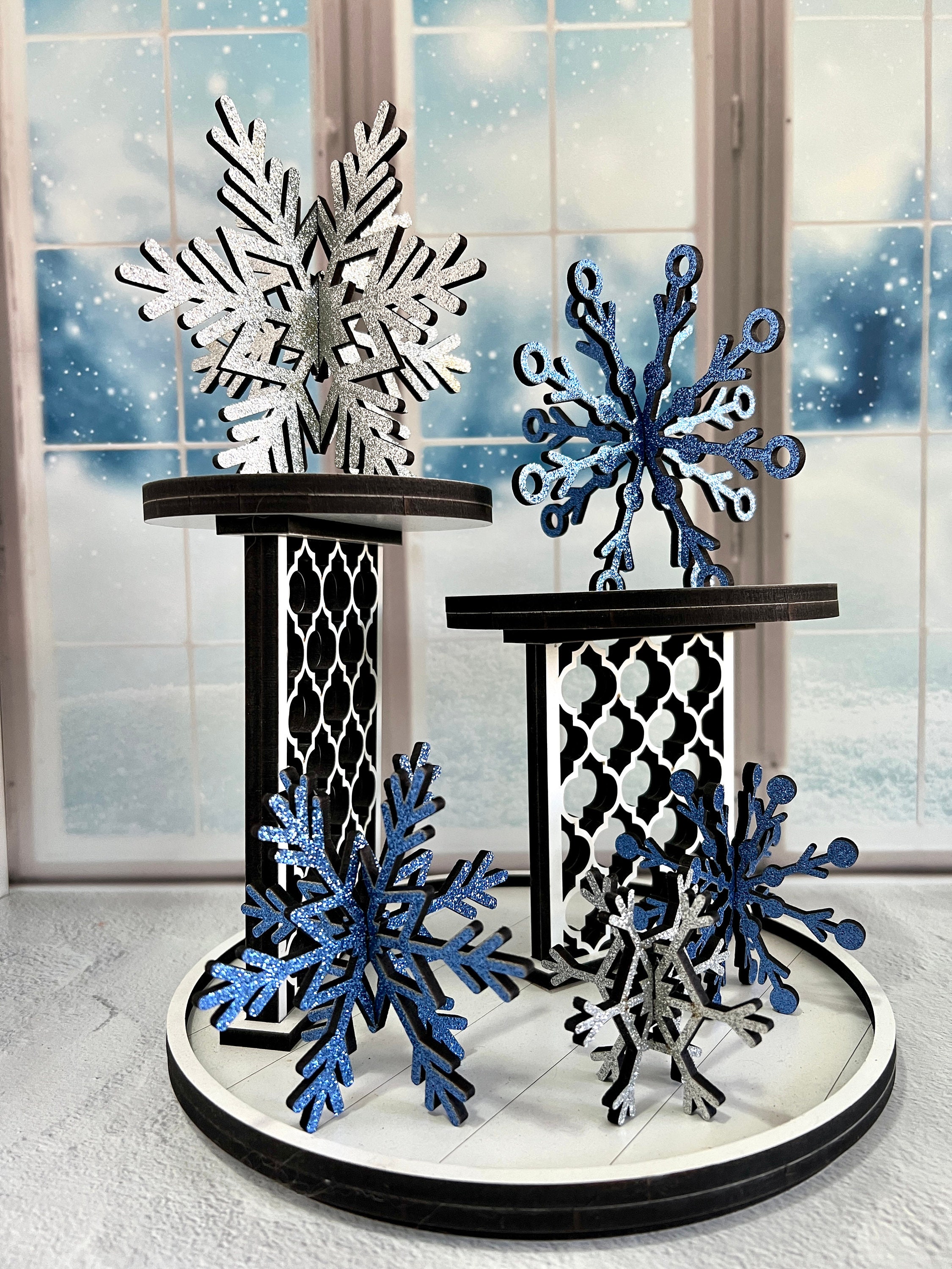 Handmade wooden snowflakes in flay lay on blue Christmas