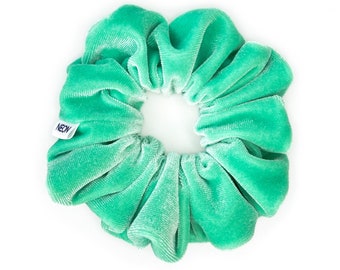 May include: A bright green velvet scrunchie with a small white label that says "NEON".