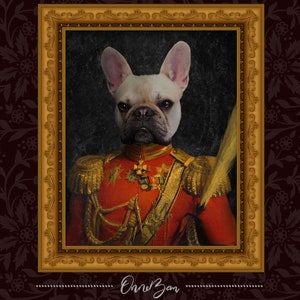 May include: A French Bulldog dressed in a red and gold military uniform with a feathered hat. The dog is wearing a gold chain with a medal around its neck. The portrait is framed in a gold frame.