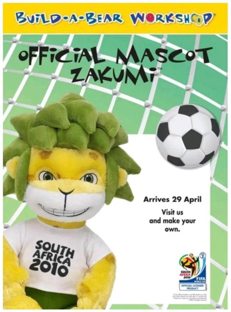May include: A Build-A-Bear Workshop advertisement featuring the official mascot Zakumi, a plush lion with green hair and a white t-shirt that says "South Africa 2010". A soccer ball is also shown. The text says "Arrives 29 April".