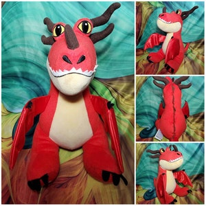 May include: A plush red dragon toy with a cream-colored belly and white teeth. The dragon has brown horns and large yellow eyes. The wings are red with a shiny finish. The dragon is a character from the "How to Train Your Dragon" franchise.