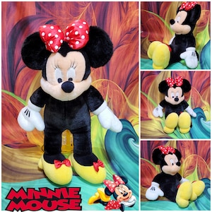 May include: A plush Minnie Mouse doll, featuring a black body, white gloves, and yellow shoes with red bows. The doll has a red bow with white polka dots on her head. The image includes multiple views of the doll.