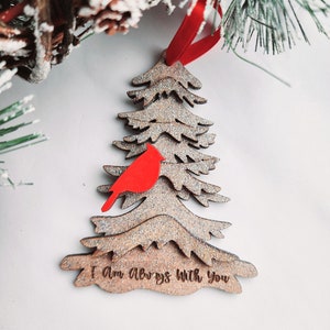 May include: Wooden Christmas tree ornament with a red cardinal and the text "I am always with you".