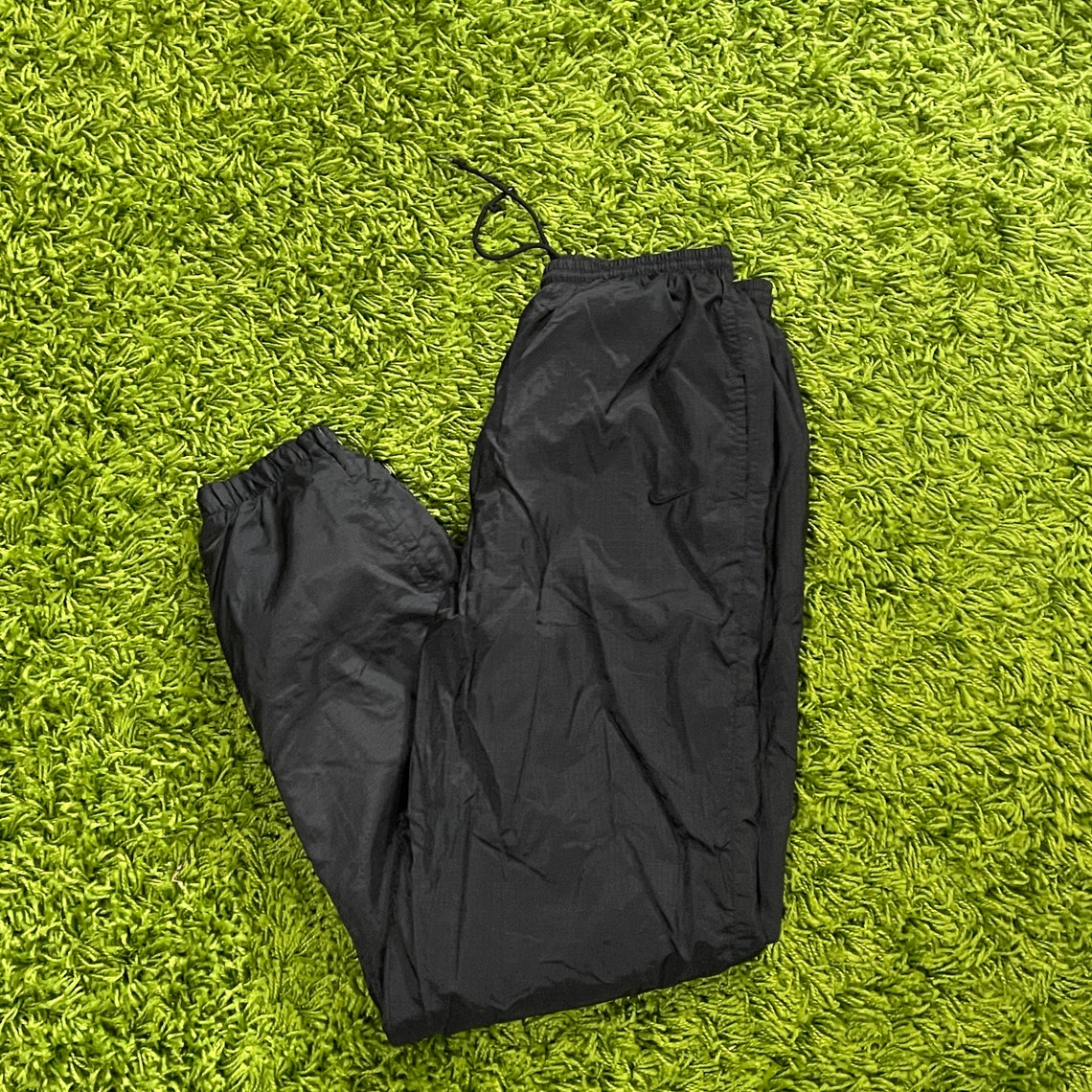 white nike windbreaker pants