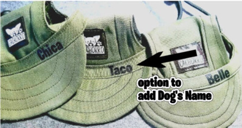 May include: Three green canvas dog hats with adjustable straps. The hats have a patch with the word "cachorro" on them. The hats are personalized with the names "Chica", "Taco", and "Belle".