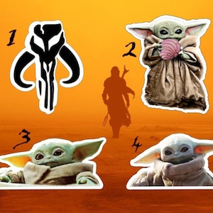 May include: Four stickers featuring characters from the Star Wars franchise. The first sticker is a black and white symbol of the Mandalorian. The second sticker is a green alien character with large ears, holding a pink object. The third and fourth stickers are the same green alien character, but in different poses.