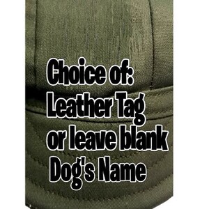 May include: A green canvas hat with the text "Choice of: Leather Tag or leave blank Dog's Name" printed on the front.