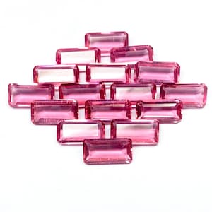 May include: A set of three ceramic mugs with a speckled, matte finish. The mugs are in shades of cream, light gray, and dark gray. Each mug has a simple, minimalist design, perfect for coffee or tea.