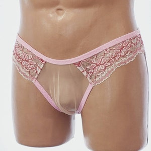 May include: Pink and white lace underwear with a sheer mesh panel. The underwear features a floral design.