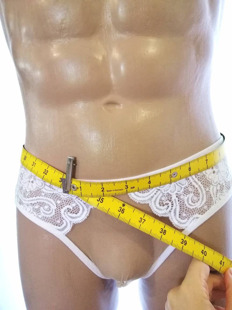 May include: White lace underwear with a yellow measuring tape around the waist. The tape reads 30 to 41 inches.