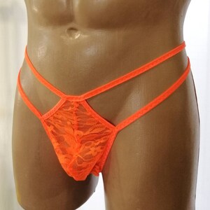 May include: Orange lace underwear with a criss-cross design.