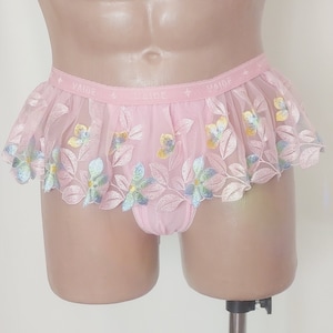 May include: Pink lace underwear with floral embroidery and the word "Vaide" repeated on the waistband.