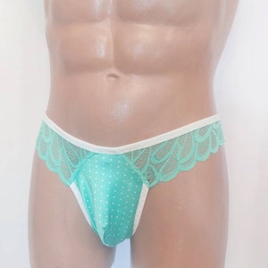May include: Mint green lace underwear with white trim and a polka dot pattern.