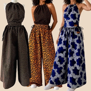 May include: Three halter-neck jumpsuits with wide-leg trousers and side-tie details. The first is black with a gold geometric pattern. The second has a black textured top and orange patterned trousers. The third features a blue floral print.