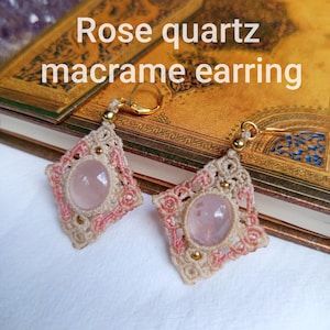 May include: A pair of earrings featuring oval rose quartz cabochons set in diamond-shaped beige and pink macrame cord frames with gold-tone metal beads and lever-back hooks. The text "Rose quartz macrame earring" is visible in the image.