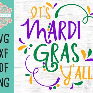 May include: It's Mardi Gras Y'all! A purple, green, and gold graphic with a festive Mardi Gras theme. The text is in a handwritten style.