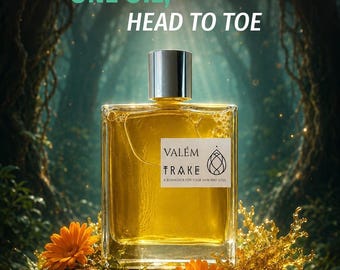 May include: A rectangular glass bottle filled with golden liquid, topped with a silver cap. The label reads VALÉM TRAKE A BIOHACKER FOR YOUR SKIN AND SOUL. Text above reads TRAKE ONE OIL, HEAD TO TOE. Text below reads Botanic 12 dry oil.