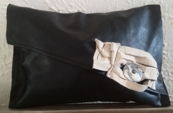 black and cream clutch bag