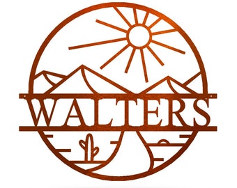 May include: A circular, rust-colored metal wall art piece featuring a desert landscape design. The design includes a sun, mountains, a cactus, and the name "WALTERS" cut out in bold letters. The artwork is set against a white background.