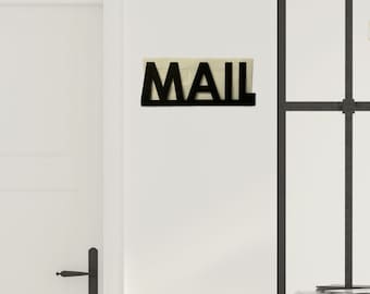 May include: Black metal mail holder with the word "MAIL" in large letters.