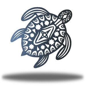 May include: A black metal turtle silhouette with a detailed mandala design. The turtle is facing right and has its head turned to the left. The design is intricate and includes circles, stars, and other geometric shapes.